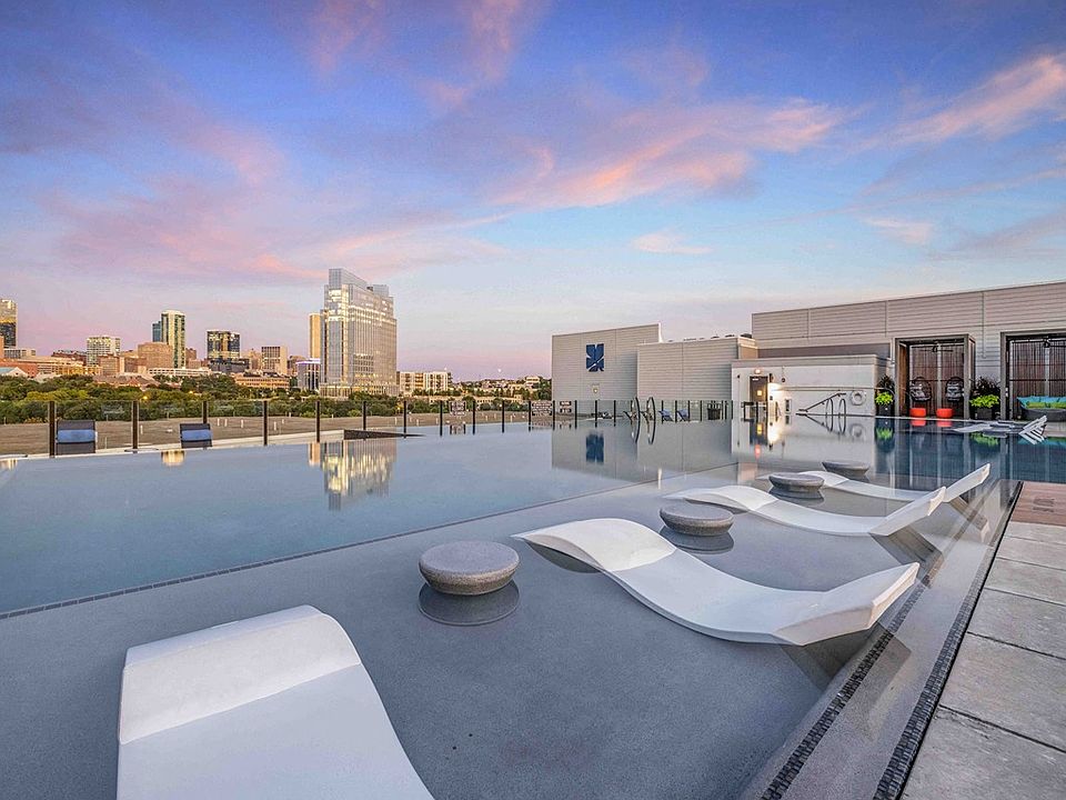 North Building Rooftop Infinity Pool with Outdoor Lounge and Cabanas