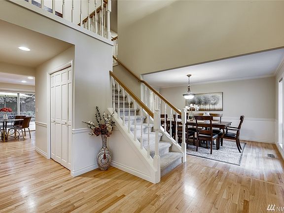 Voluminous entry with formal dining room to the right, formal living room to the left and ahead the family room, kitchen, and casual dining area. Light and bright throughout with an abundance of windows and lots of skylights. 