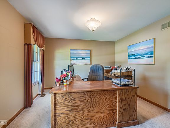 The office overlooking the front yard.  This could also make a great dining room or toy room.