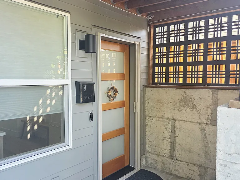 Covered private entry. Screen door and pull down interior shades.