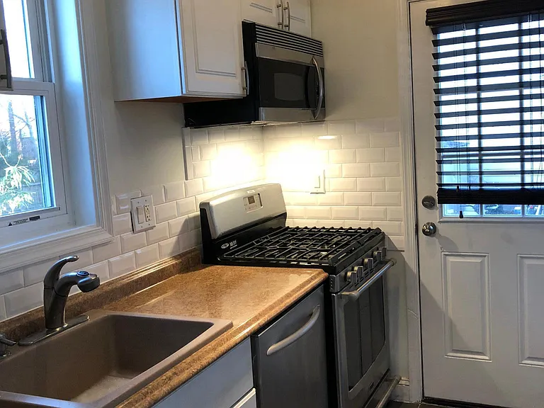 Kitchen w Stainless Steel appliances. old photos from prior listing