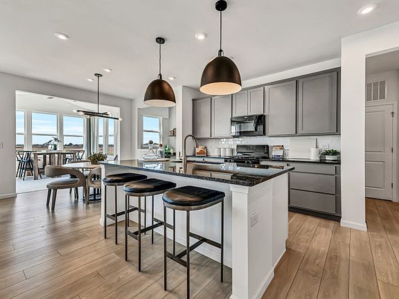 Kitchen with Large Island and Pendant Lighting