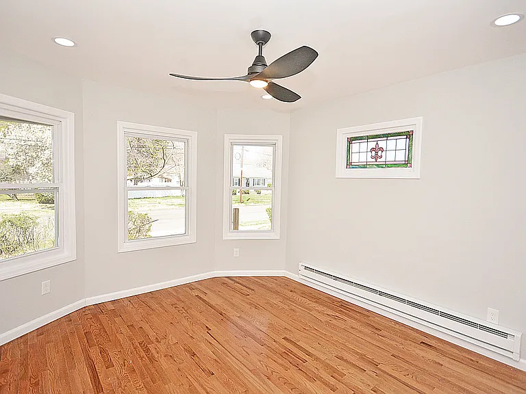 Beautiful stained glass with and plenty of natural light to highlight the new hardwood floor.