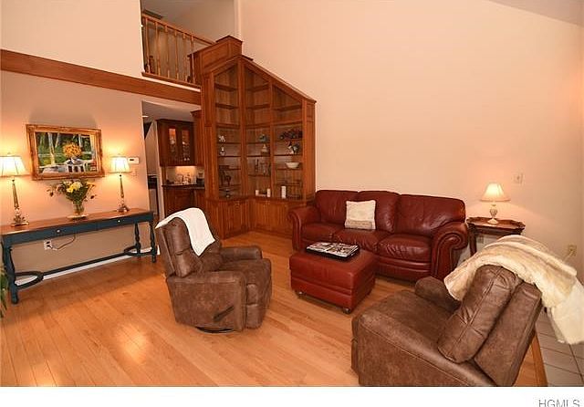 Spacious livingroom w/hardwood floors and SGD to wrap around deck.