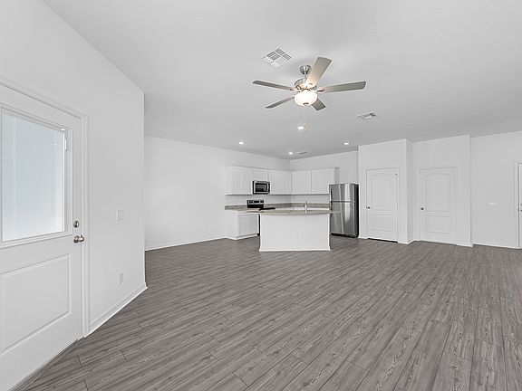 The entertainment space is open-concept, including the dining room, family room and kitchen