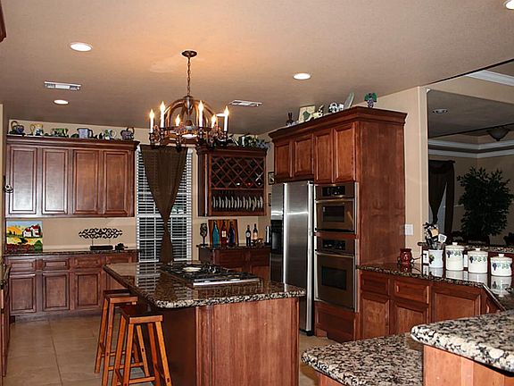 Large kitchen, granite counter tops, under cabinet lighting,. Lots of storage, terrific pantry area