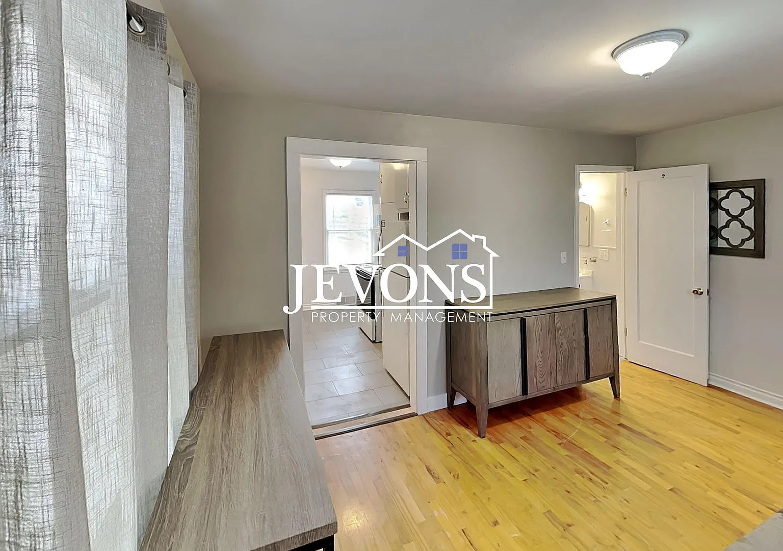 A 2-bedroom home with a 2-car garage plus driveway parking, and an in-unit washer and dryer — Photo 4