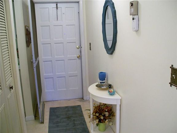 Entry door with screened entry door too and foyer