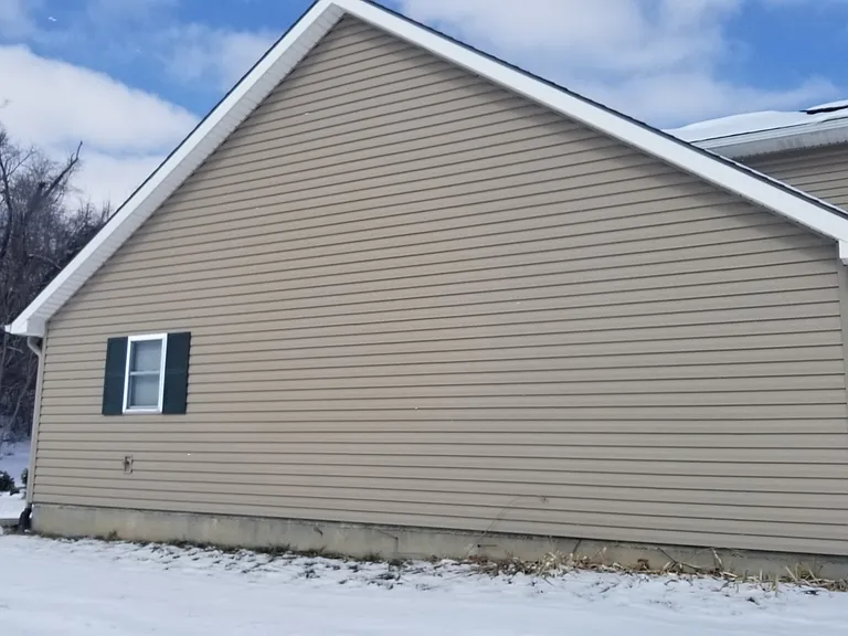 West side of duplex. Kitchen window shown.