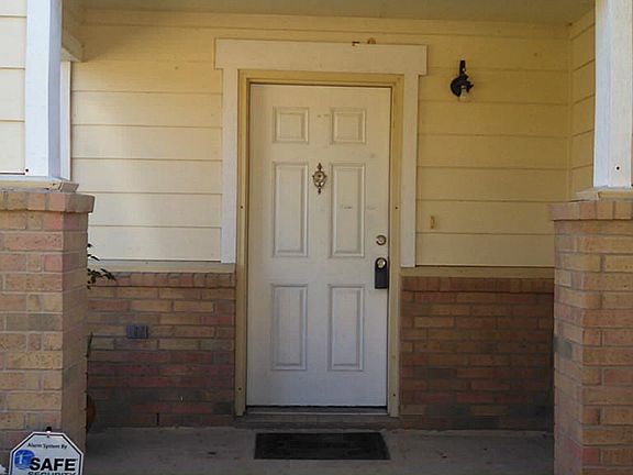  Love the covered porch at this front door.
