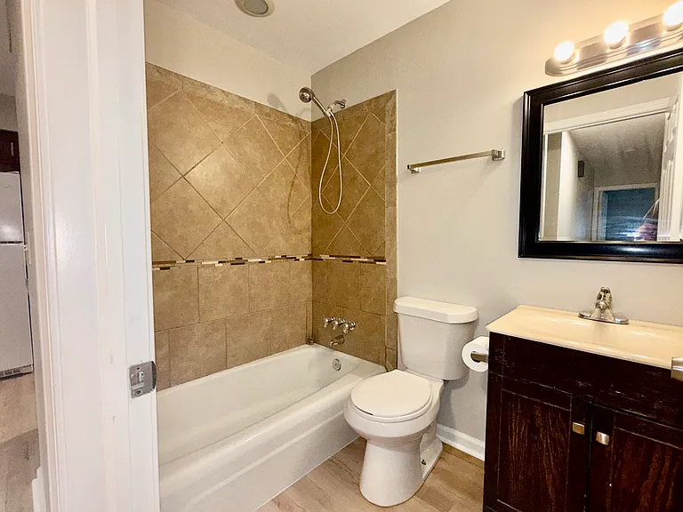 Full bath that we are still working on. Will get updated lighting and fresh coat of paint on vanity.
