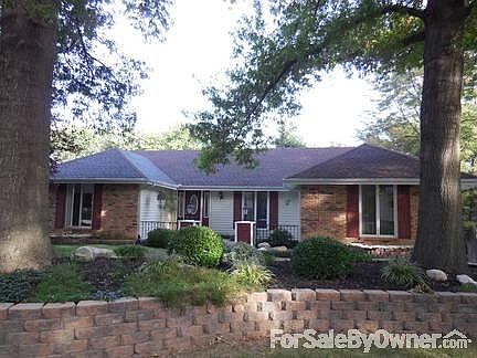 Front View : On quiet cul-de- sac. Awesome landscaping and two fountains. Large trees.