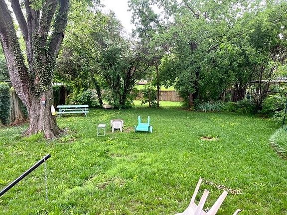 Huge backyard with trees