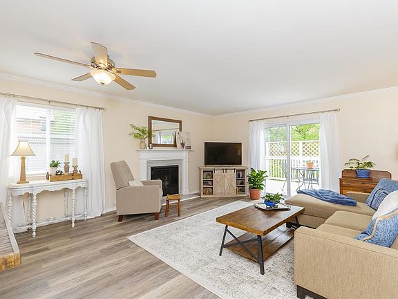 Spacious great room with classic and convenient gas start fireplace for easy on-off ambiance