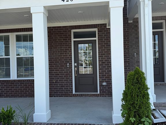Front door with keyless entry and Ring doorbell.