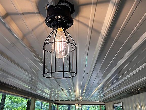 Cage lights under porch