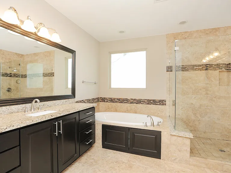Master bath with hot tub and beautiful walk in shower.