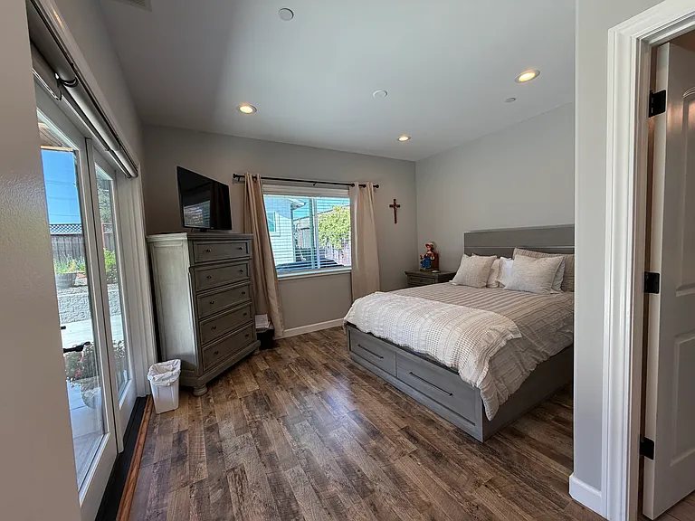 principal suite located at north side of the back of the house. With access to the back patio.