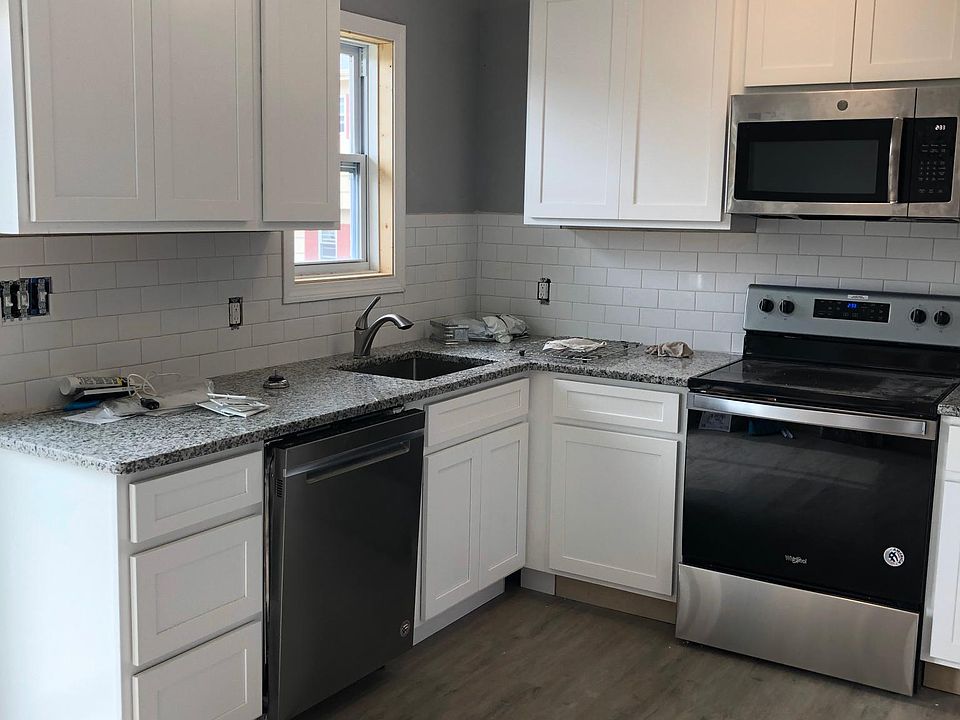 Brand new kitchen with White, Shaker cabinets. Tons of storage for this size condo.