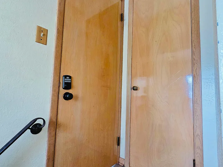 Back entrance with keypad and storage closet