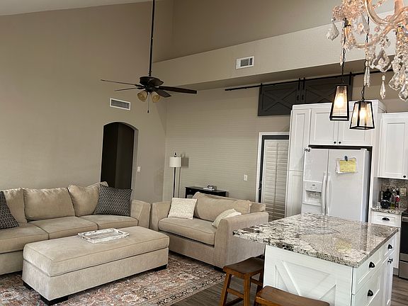 Beautiful island with granite countertops with pull out drawers.