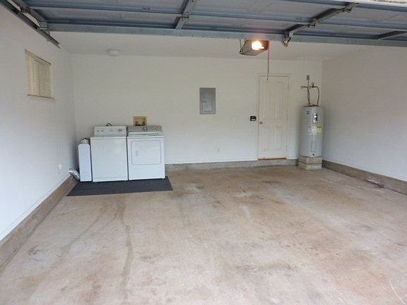 Enclosed Garge With Full Size Washer &#38; Dryer