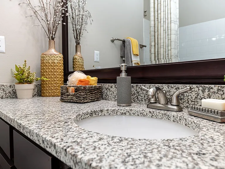 Bright bathroom with granite counters