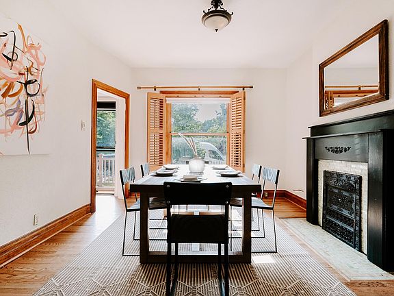 Front Room with big window and hardwood shutters. Fireplace is decorative only.