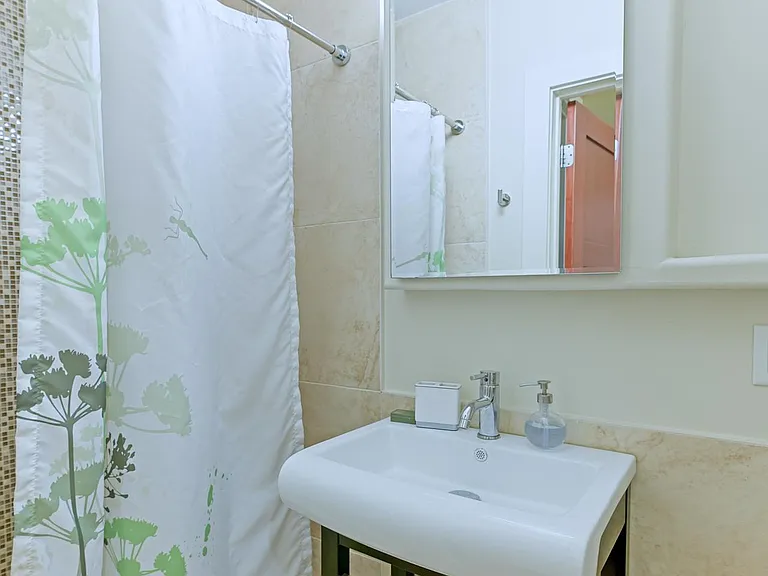 Private bathroom with 3'x3' tile shower.