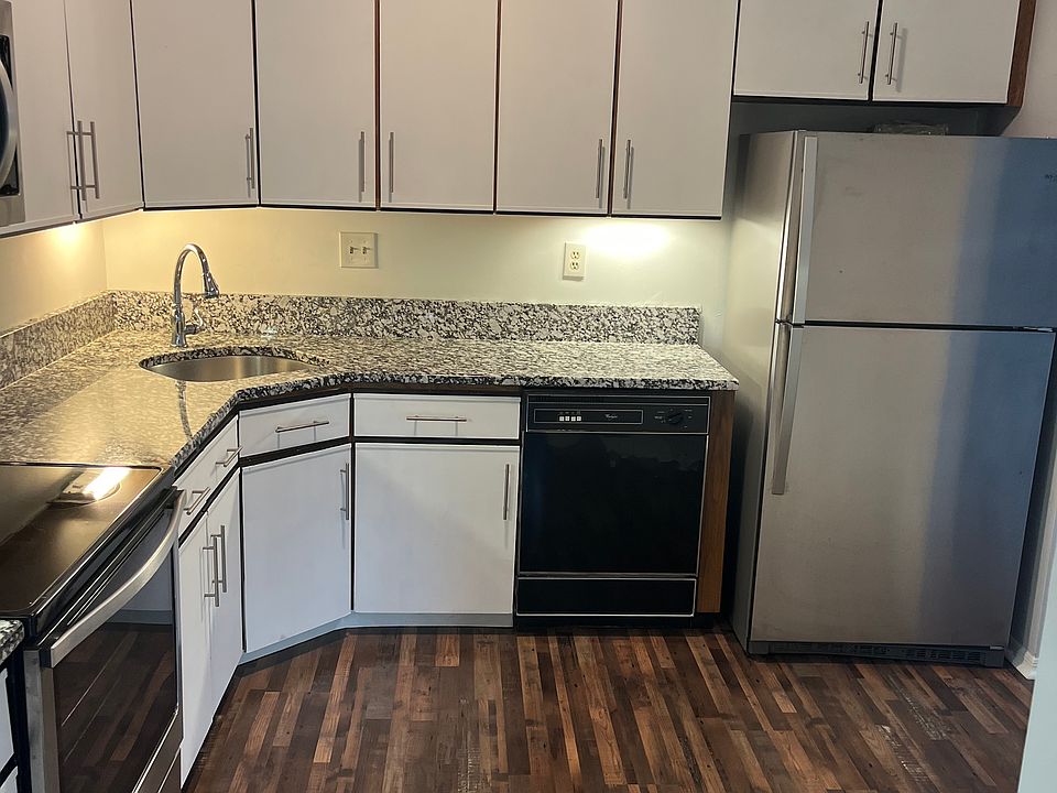 Kitchen with new hardware stainless new granite countertops and sink faucet ceiling fan with light and remote control appliances two microwave oven's