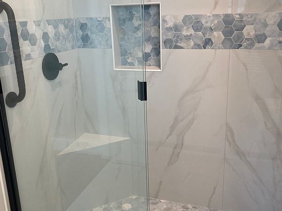 All new shower with foot rest and hand rail.