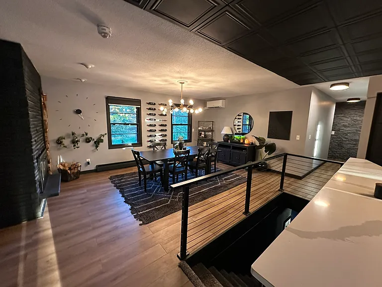 Garage door and Front door entry into open kitchen, dining and living areas.
