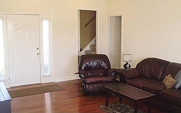 Another view of great room. Stairs lead to Bonus Room - office or media room!