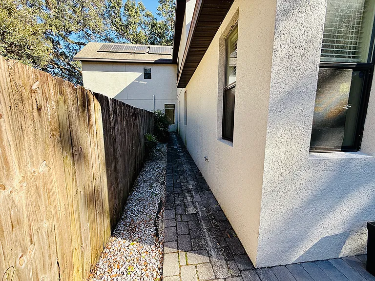 Big Fence in Back Yard house paved all around