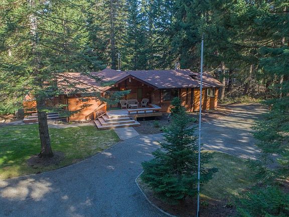 Front of cabin with circular drive way. This darling cabin is nestled in the trees & very secluded. 