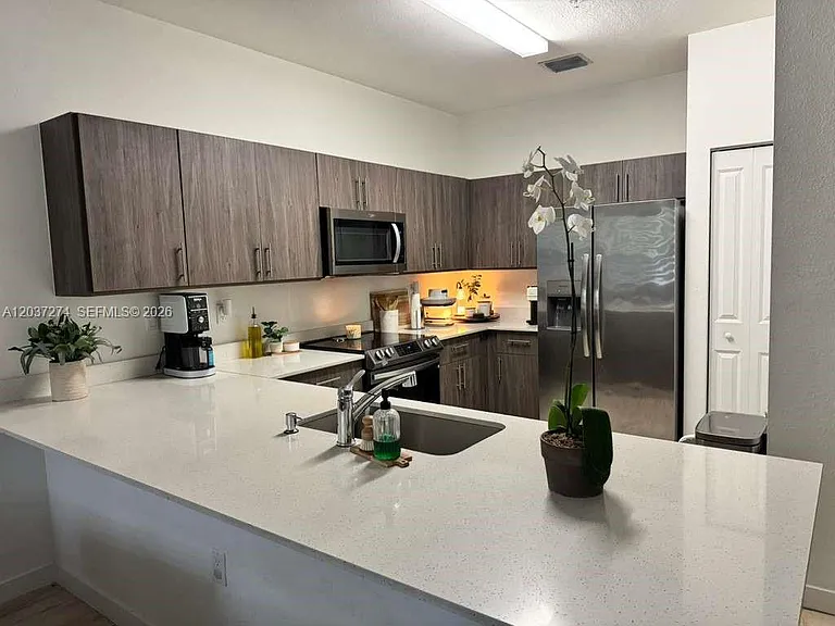 15540 SW 136th St #4-101 — Photo 1