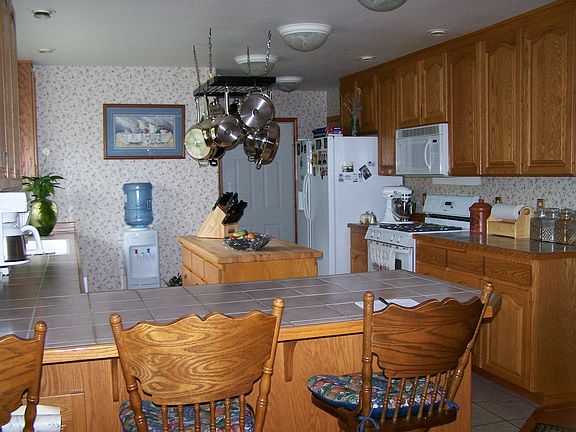 View of kitchen - all appliances stay!