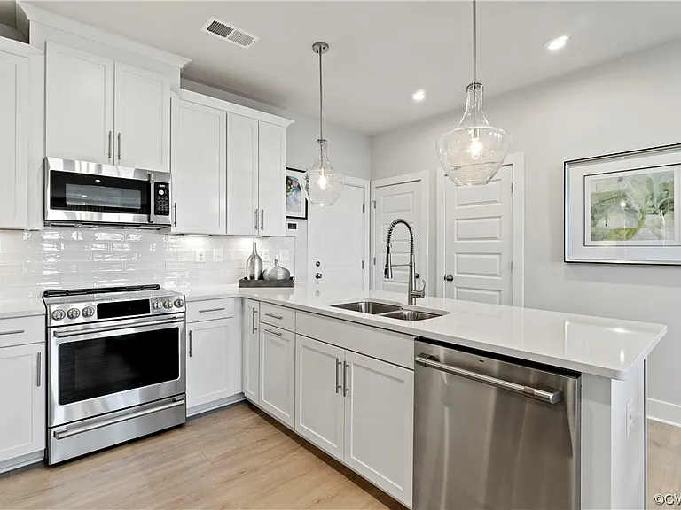 Some photos include stock images of an identical model home. Actual unit finishes, views, and colors may differ.