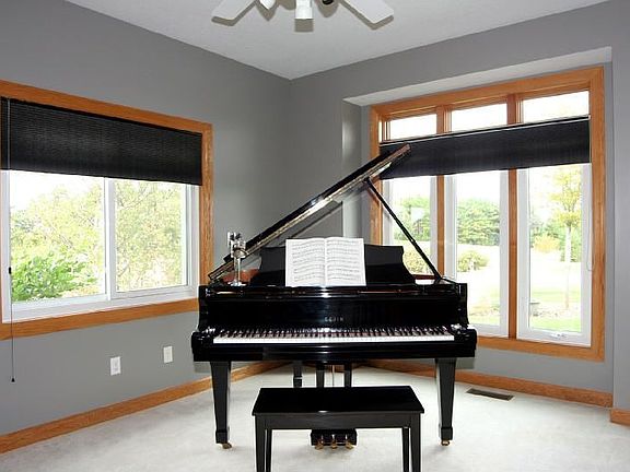 This main level den would be great as a 5th bedroom!