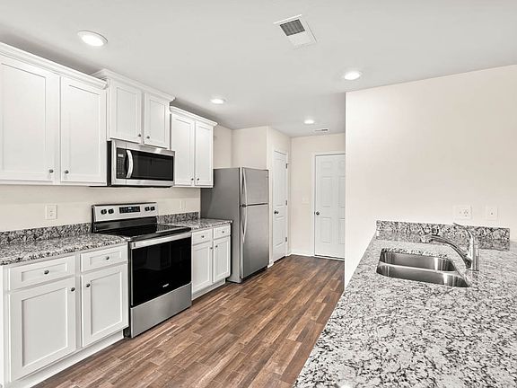 Stainless steel appliances included in the kitchen