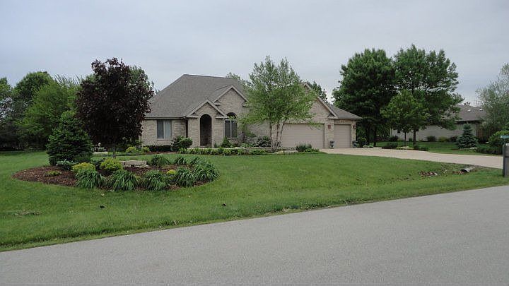 Stunning 3 bedroom brick ranch with many extras on nearly 1 acre lot
