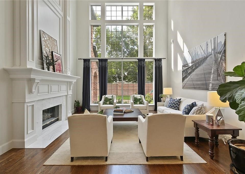 Wall of windows welcomes you to this light filled home