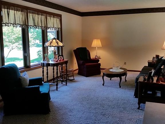 Another view of the living room. Beautiful updated wood casement windows overlook front yard.