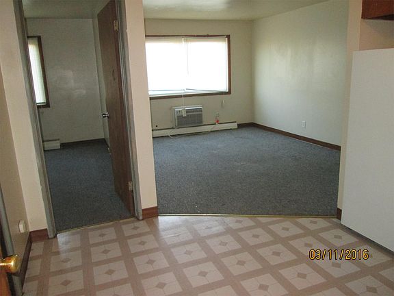 View of living room from kitchen entrance door.