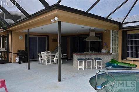 Outdoor kitchen and covered lanai.