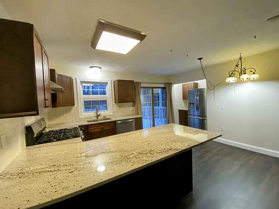 Updated kitchen with sliding glass doors to the back deck.