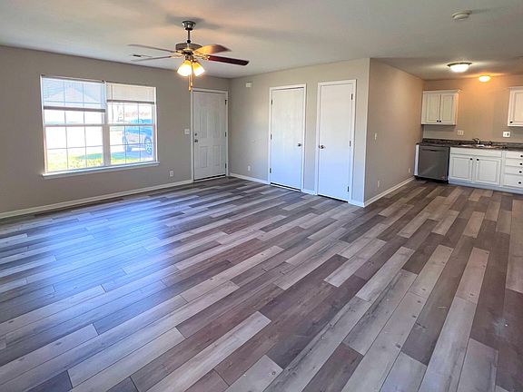 HUGE LR OPEN TO KITCHEN. DOOR TO GARAGE AND COAT CLOSET ALSO SHOWN IN PHOTO