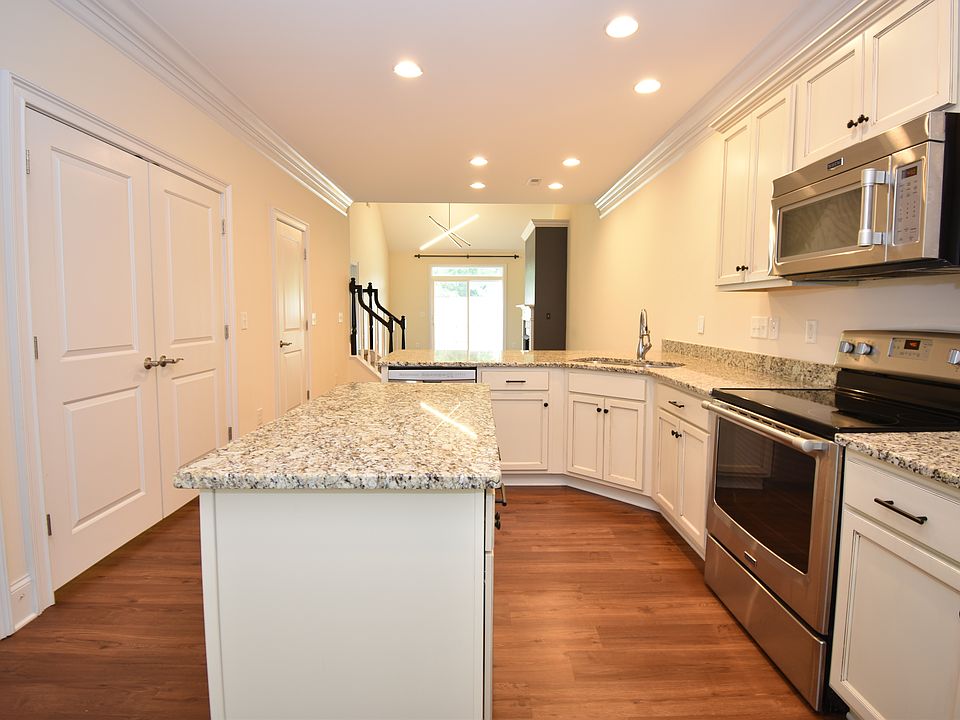 The counter space and storage in this kitchen are amazing. The Stainless Appliances add a wonderful feel to the space. Across from the kitchen is the first floor laundry and half bath.
