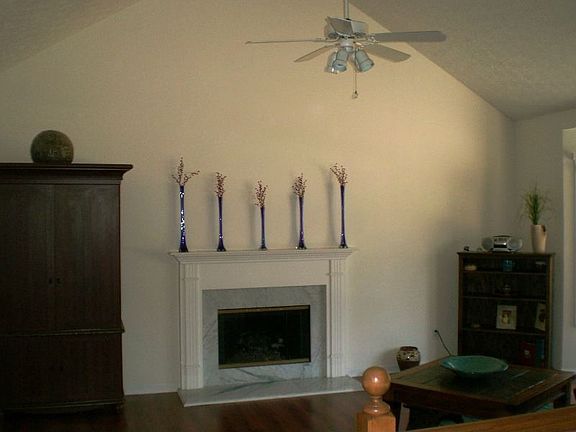 Vaulted Great room w/hardwood floors & marble fireplace