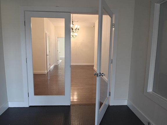 Formal foyer opens stairs and elevator